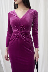 Velvet bodycon dress with V-neckline, ruched waist detail, and long fitted sleeves